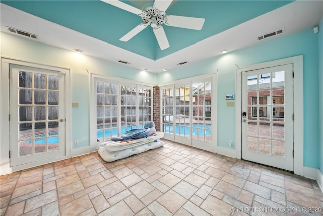 interior space with vaulted ceiling and ceiling fan