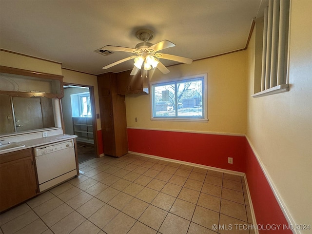 kitchen featuring light tile patterned flooring, ceiling fan, white dishwasher, and a healthy amount of sunlight