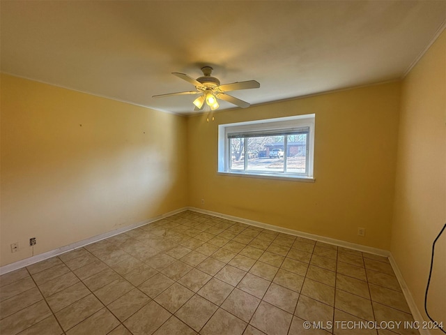 unfurnished room with light tile patterned floors, ceiling fan, and ornamental molding