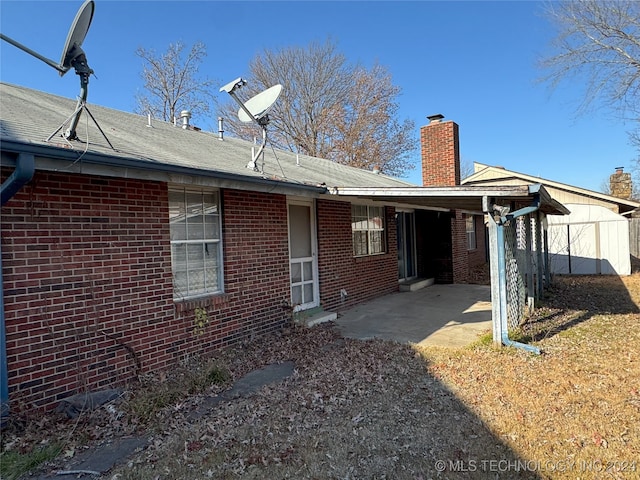 rear view of property with a patio