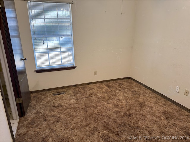 unfurnished room with carpet floors