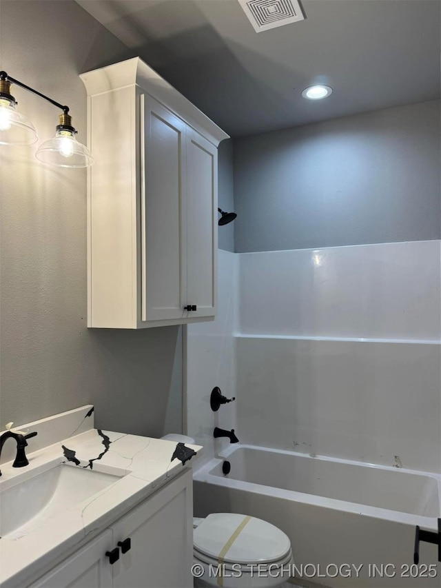 full bathroom with vanity,  shower combination, and toilet