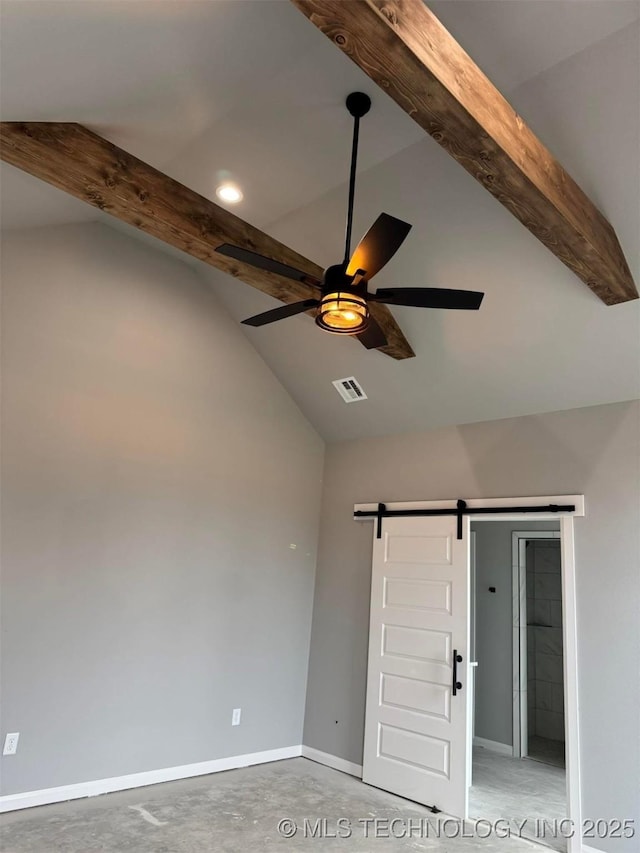 unfurnished room with a barn door, vaulted ceiling with beams, concrete floors, and ceiling fan