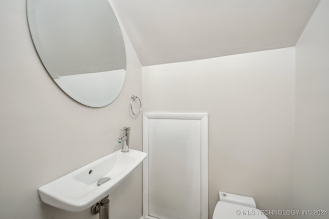 bathroom with a sink and toilet