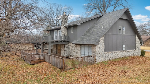 view of property exterior with a deck