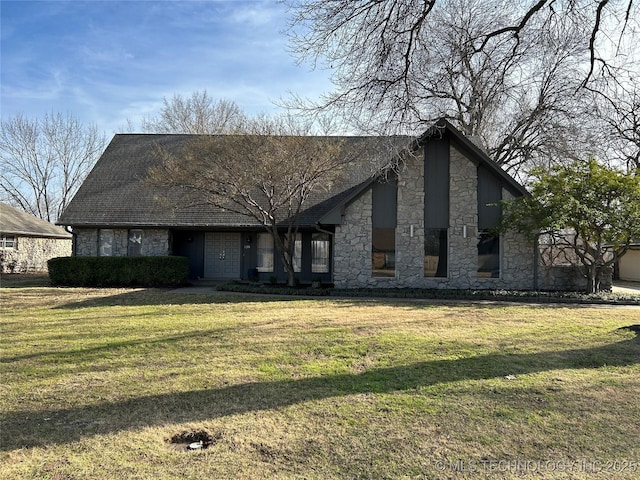 view of front of home featuring stone siding and a front yard