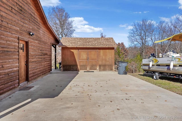 view of patio / terrace featuring a storage shed