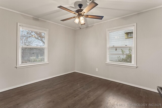 spare room featuring ceiling fan, dark hardwood / wood-style flooring, and crown molding