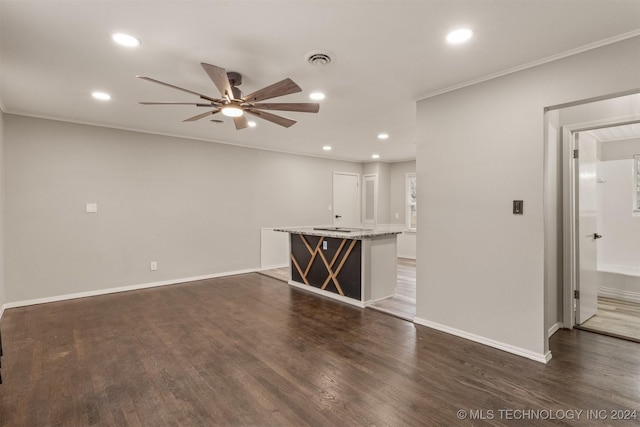 unfurnished living room with ceiling fan, dark hardwood / wood-style flooring, and ornamental molding