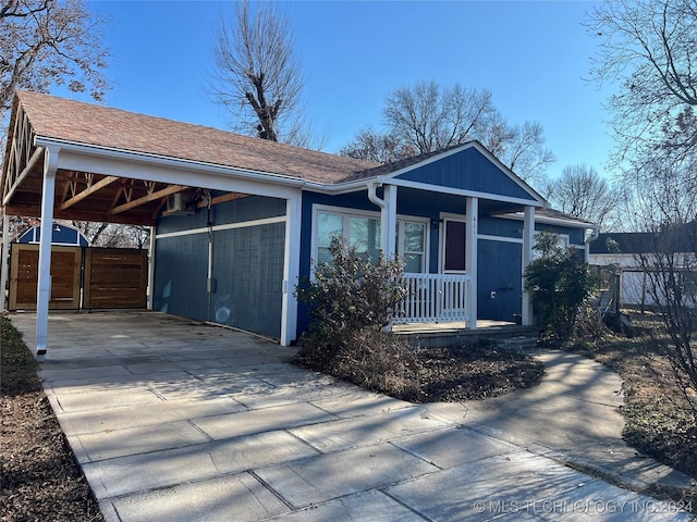 view of front of house featuring a porch and a carport