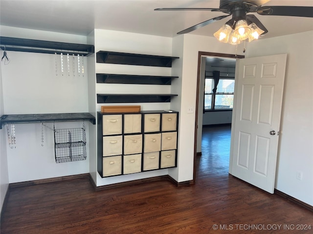 unfurnished bedroom featuring dark hardwood / wood-style floors and ceiling fan