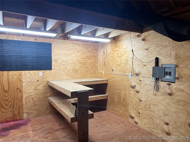 basement featuring a workshop area and hardwood / wood-style flooring