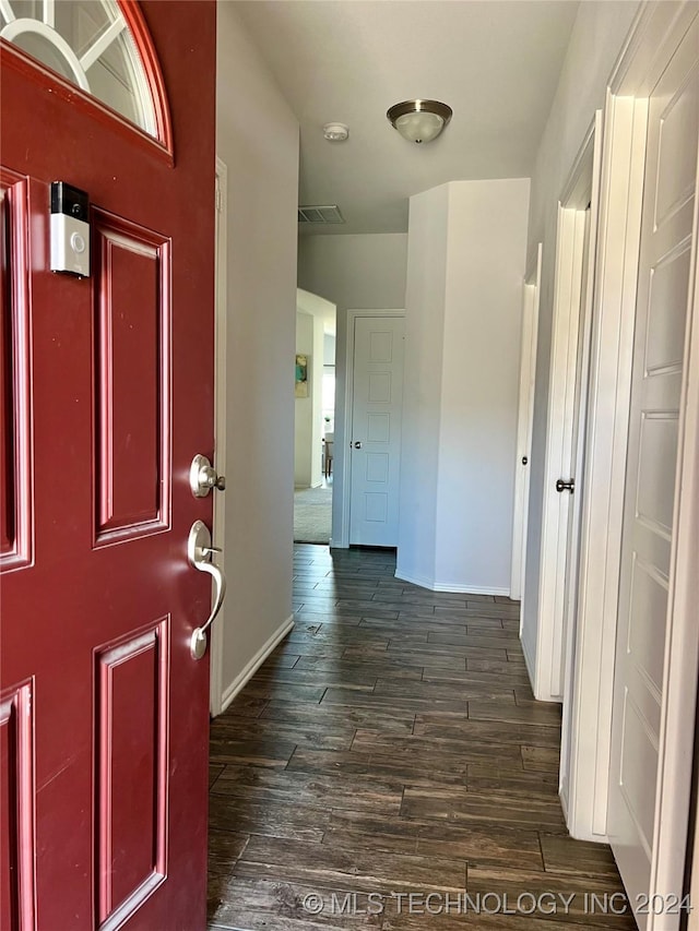 foyer entrance with dark hardwood / wood-style floors