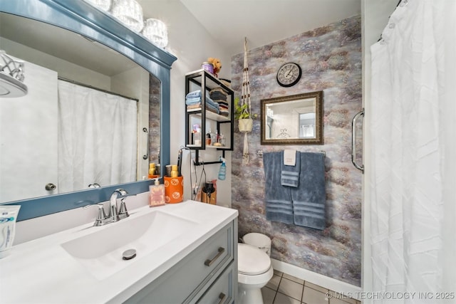 bathroom featuring vanity, tile patterned floors, and toilet