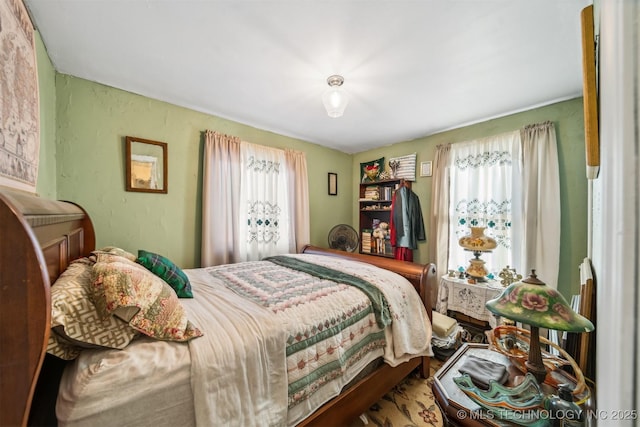 bedroom featuring multiple windows