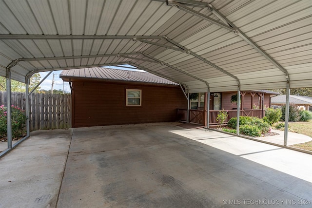 view of vehicle parking with a carport