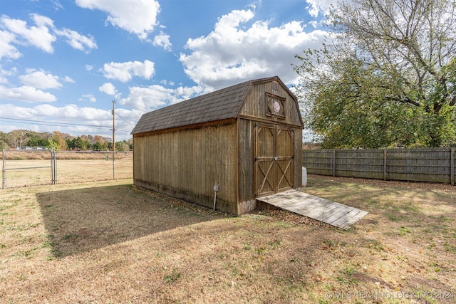 view of outdoor structure with a lawn