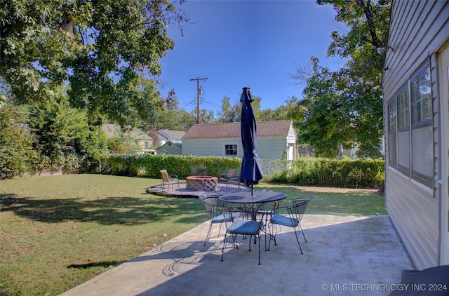 view of patio / terrace featuring an outdoor fire pit