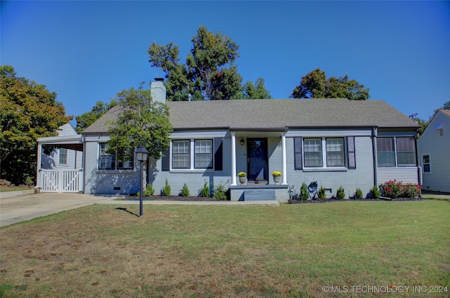 ranch-style home with a front lawn