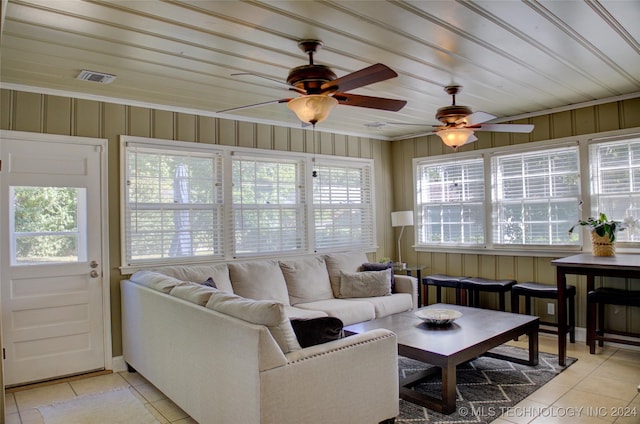 sunroom featuring ceiling fan