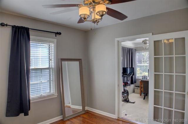 unfurnished room with ceiling fan and wood-type flooring