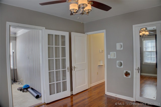 interior space with ceiling fan and dark wood-type flooring