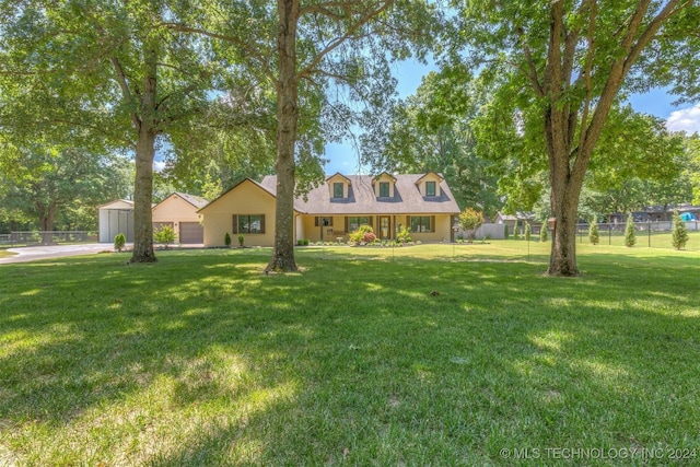 cape cod house featuring a front lawn