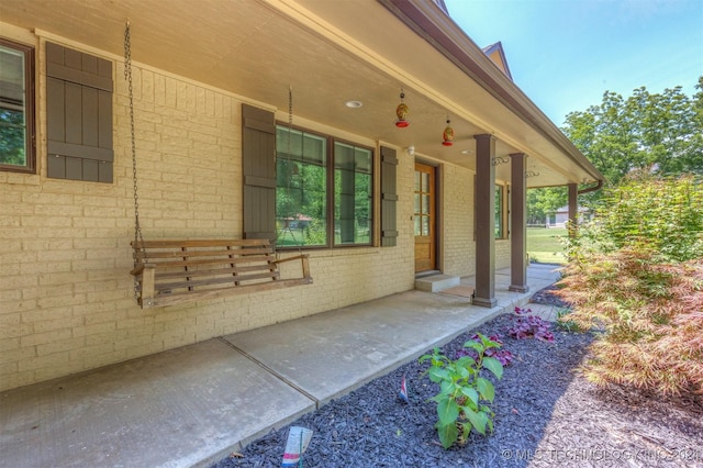 property entrance featuring covered porch