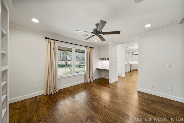 unfurnished living room with dark hardwood / wood-style flooring, ceiling fan, and ornamental molding