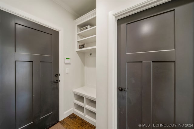 mudroom with dark hardwood / wood-style flooring and ornamental molding