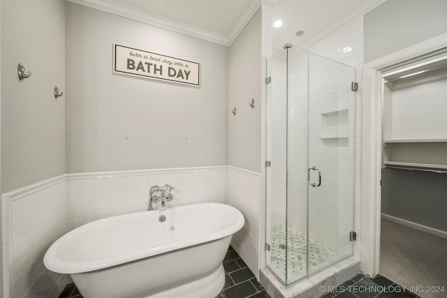 bathroom featuring tile patterned flooring, separate shower and tub, crown molding, and tile walls