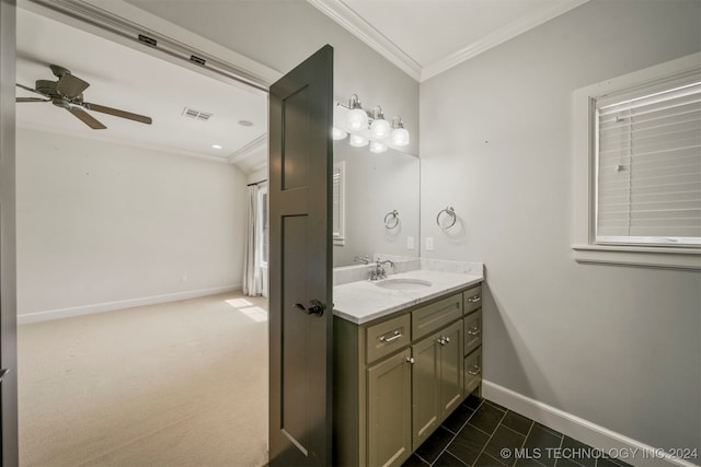 bathroom featuring tile patterned flooring, vanity, ceiling fan, and ornamental molding