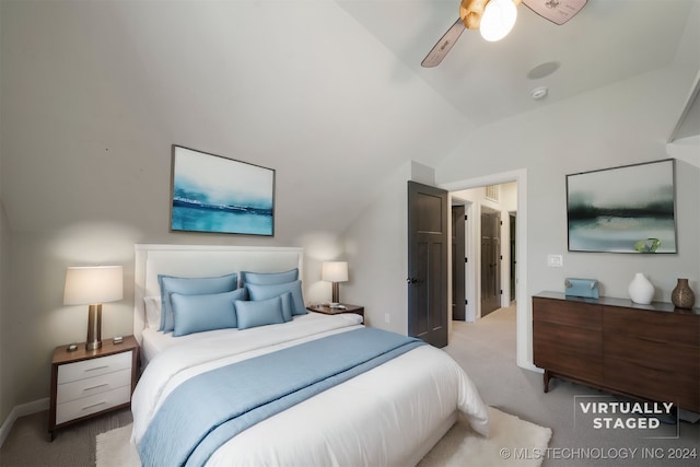 carpeted bedroom with ceiling fan and lofted ceiling