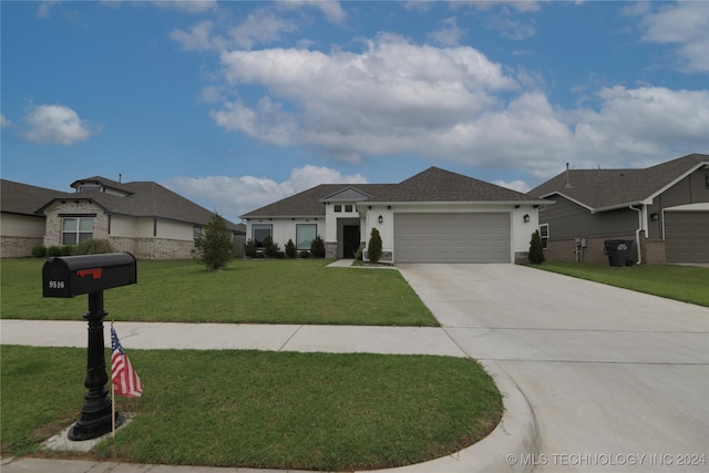 view of front facade featuring a garage and a front yard