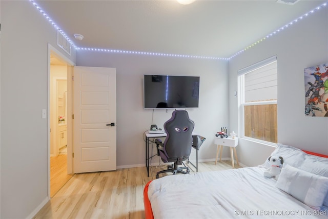 bedroom featuring light wood-type flooring