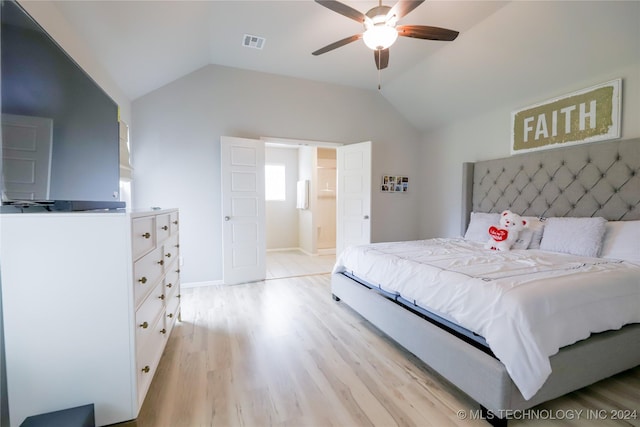 bedroom with ceiling fan, light hardwood / wood-style floors, and vaulted ceiling