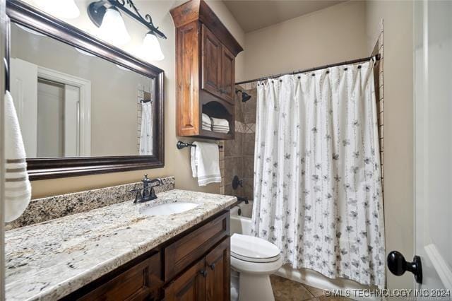 full bathroom with tile patterned floors, vanity, toilet, and shower / bathtub combination with curtain