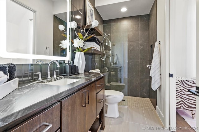 bathroom featuring recessed lighting, vanity, toilet, and tile patterned floors