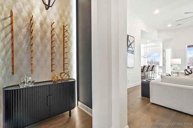 interior space featuring baseboards, wood finished floors, and recessed lighting