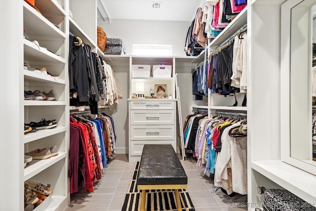 walk in closet with light tile patterned floors and visible vents