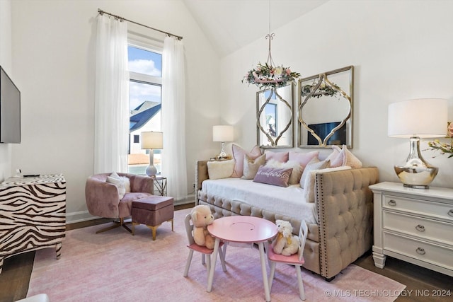 bedroom featuring vaulted ceiling and wood finished floors