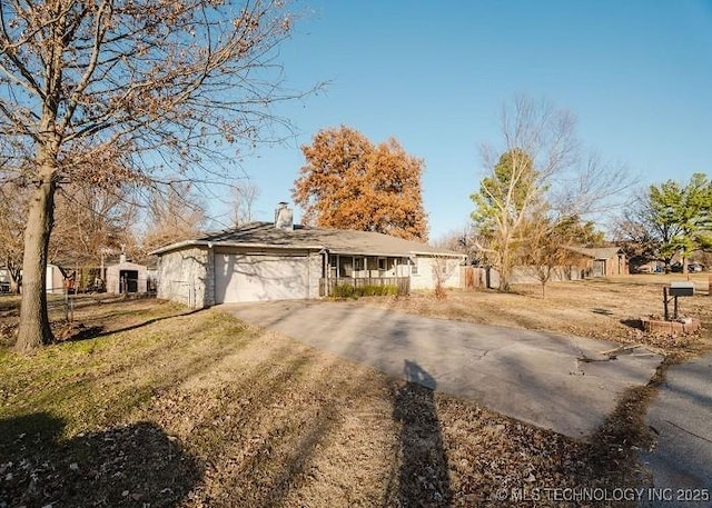 ranch-style home featuring a garage and a front yard