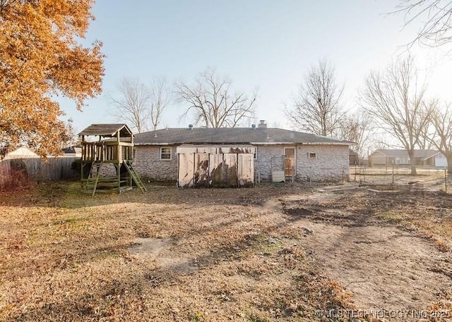 rear view of house with a playground