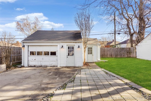 garage featuring a lawn