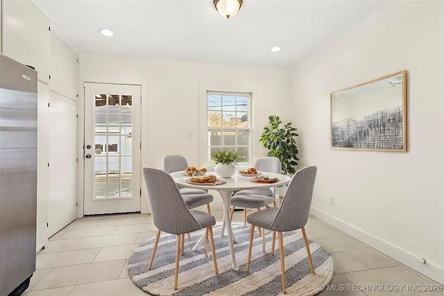 dining area featuring light tile patterned flooring