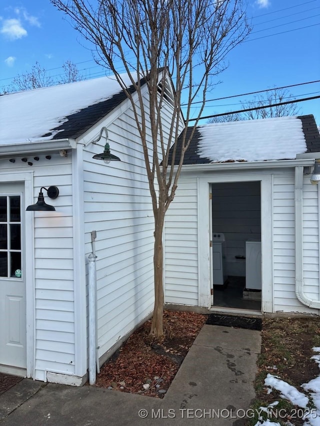 exterior space with washer and clothes dryer