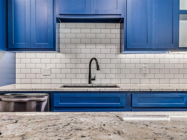 room details with decorative backsplash, light stone countertops, dishwasher, and sink