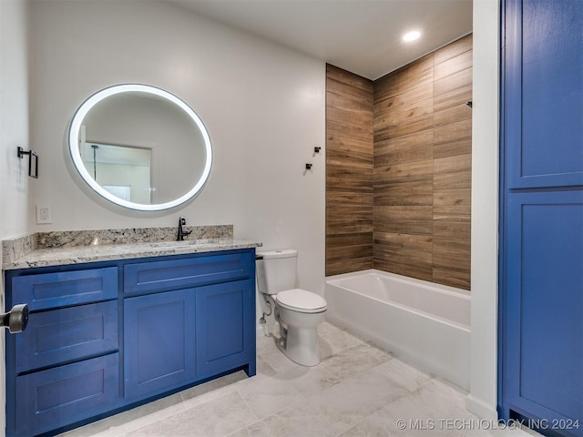 full bathroom with vanity, tiled shower / bath combo, and toilet