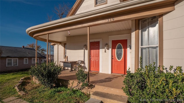 doorway to property featuring a porch