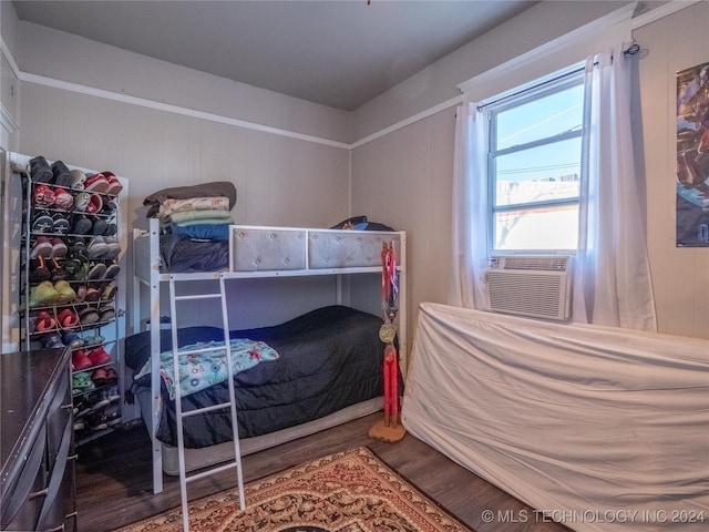 bedroom featuring cooling unit and wood-type flooring